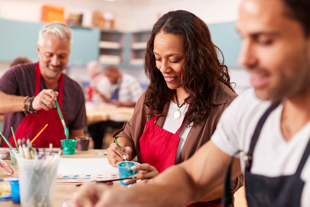 Group of Mature Adults Attending Art Class in Community Centre