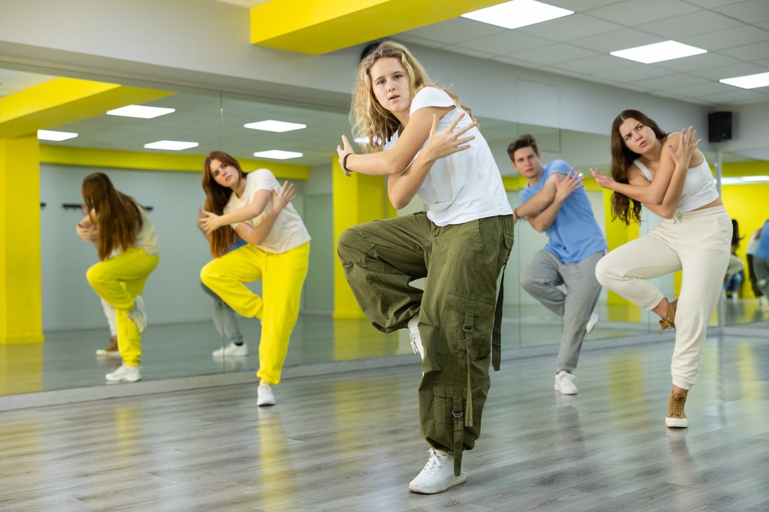Teen girl in wide pants dancing hip hop