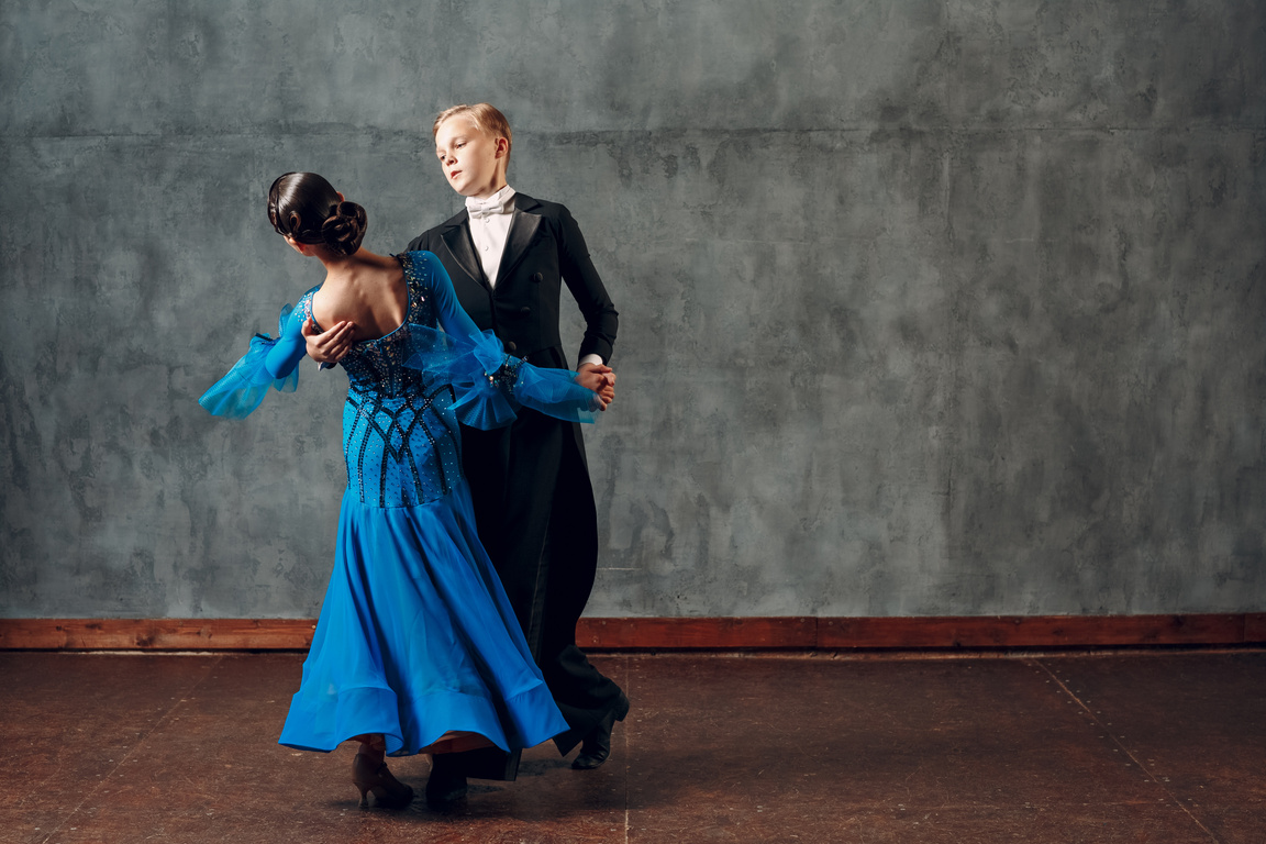 Ballroom Foxtrot Dancing. Young Couple Ballroom Dancers. Studio Shot